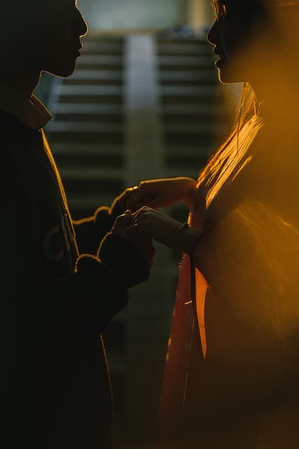 A young person speaking passionately into a professional microphone, recording a podcast episode.